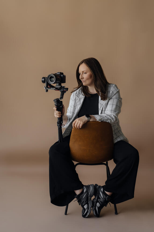 Ievgeniia, host of Michigan Wedding Insider and founder of Lights Camera Vows